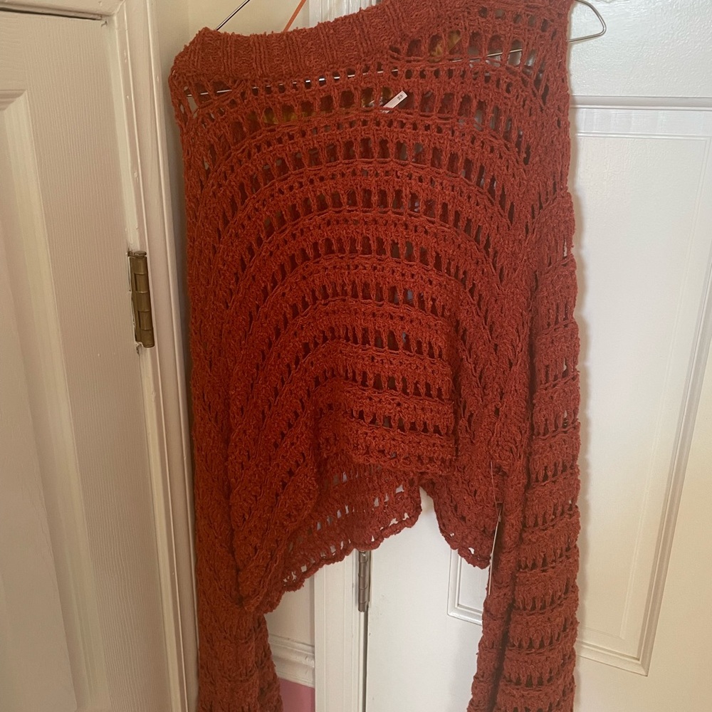 Super cute free people sweater with bell bottom sleeves!